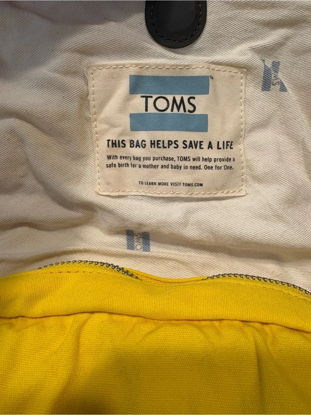 TOMS Citrus Waxed Canvas Trekker Backpack with Brown Base and Roll-Top Closure